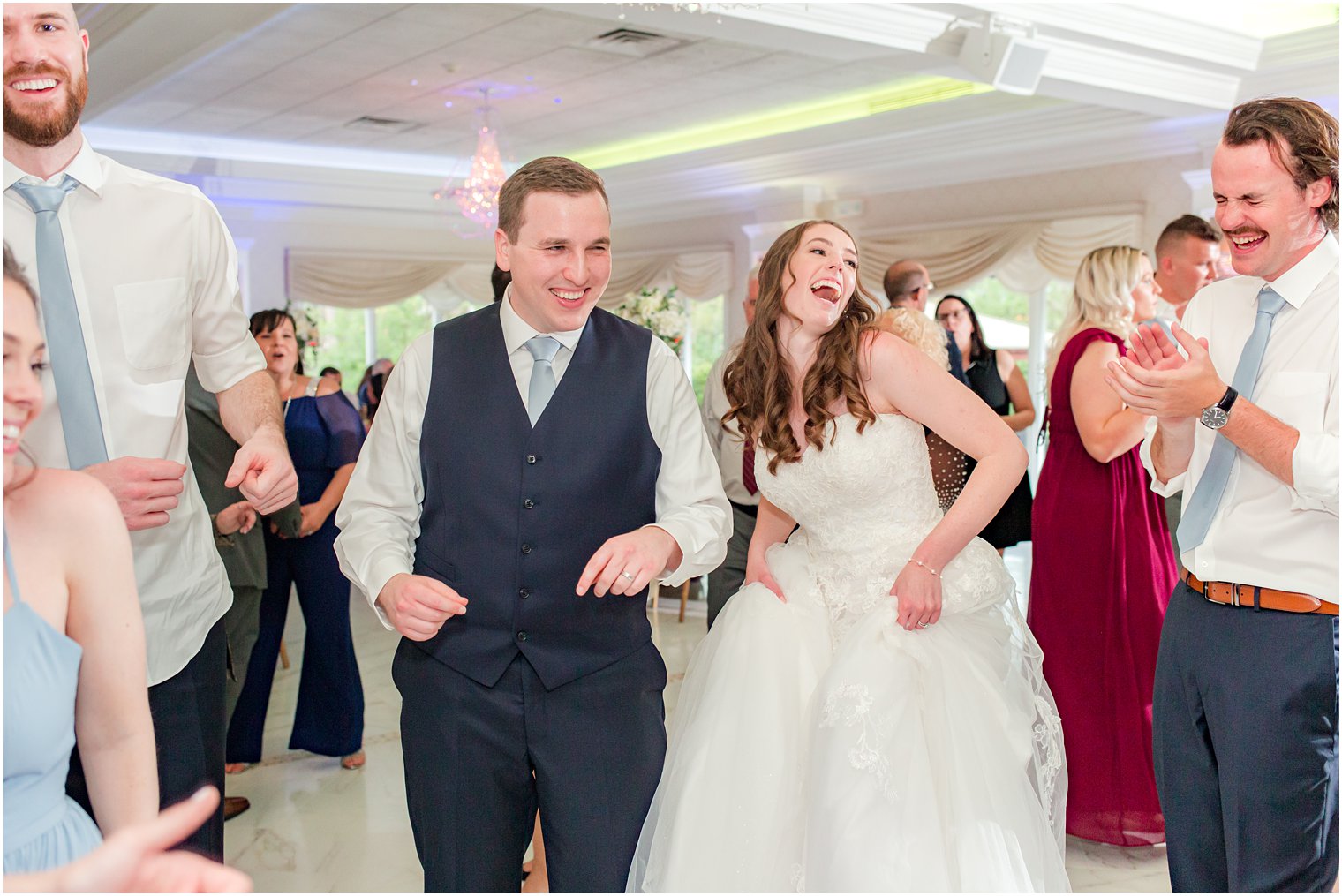 newlyweds dance with guests during NJ wedding reception 