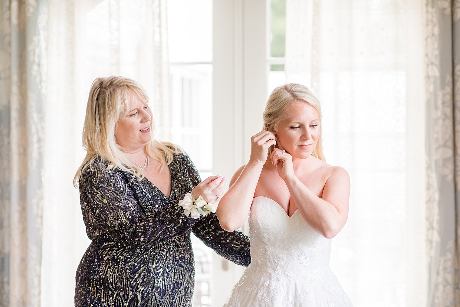 bride's mother helps with jewelry before NJ wedding