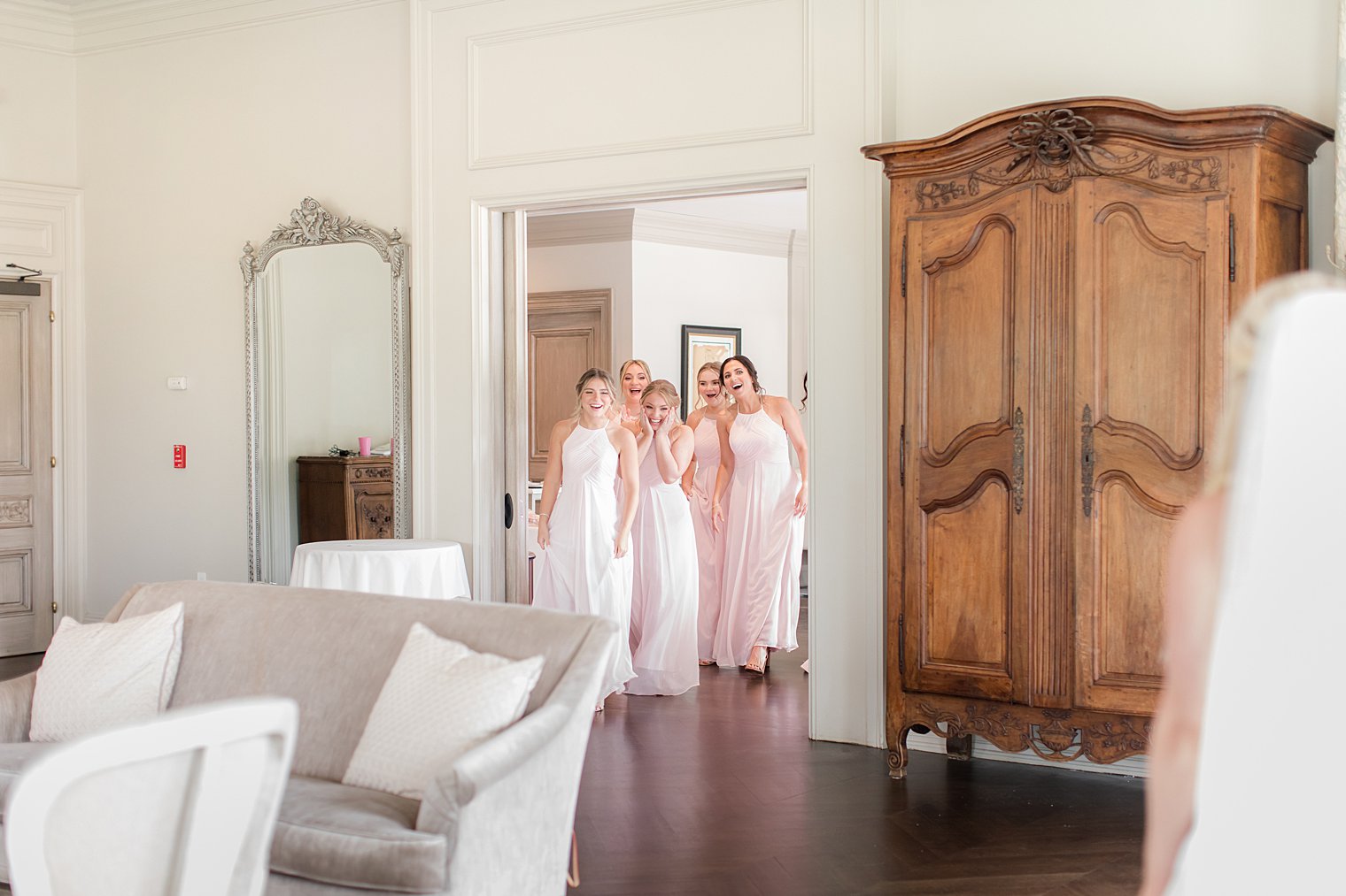 bridesmaids see bride for the first time on wedding day