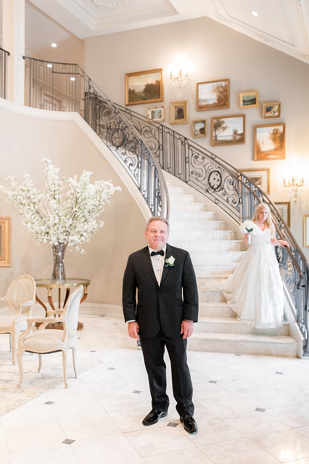 bride walks down staircase for first look with dad in New Jersey