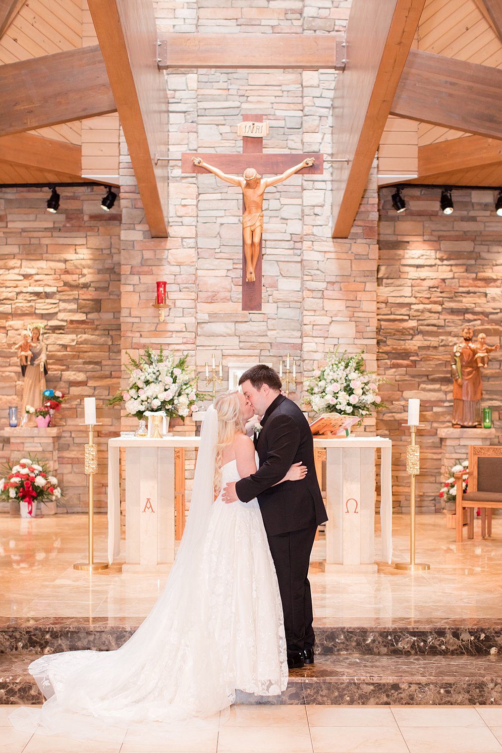 bride and groom kiss during traditional church wedding in New Jersey