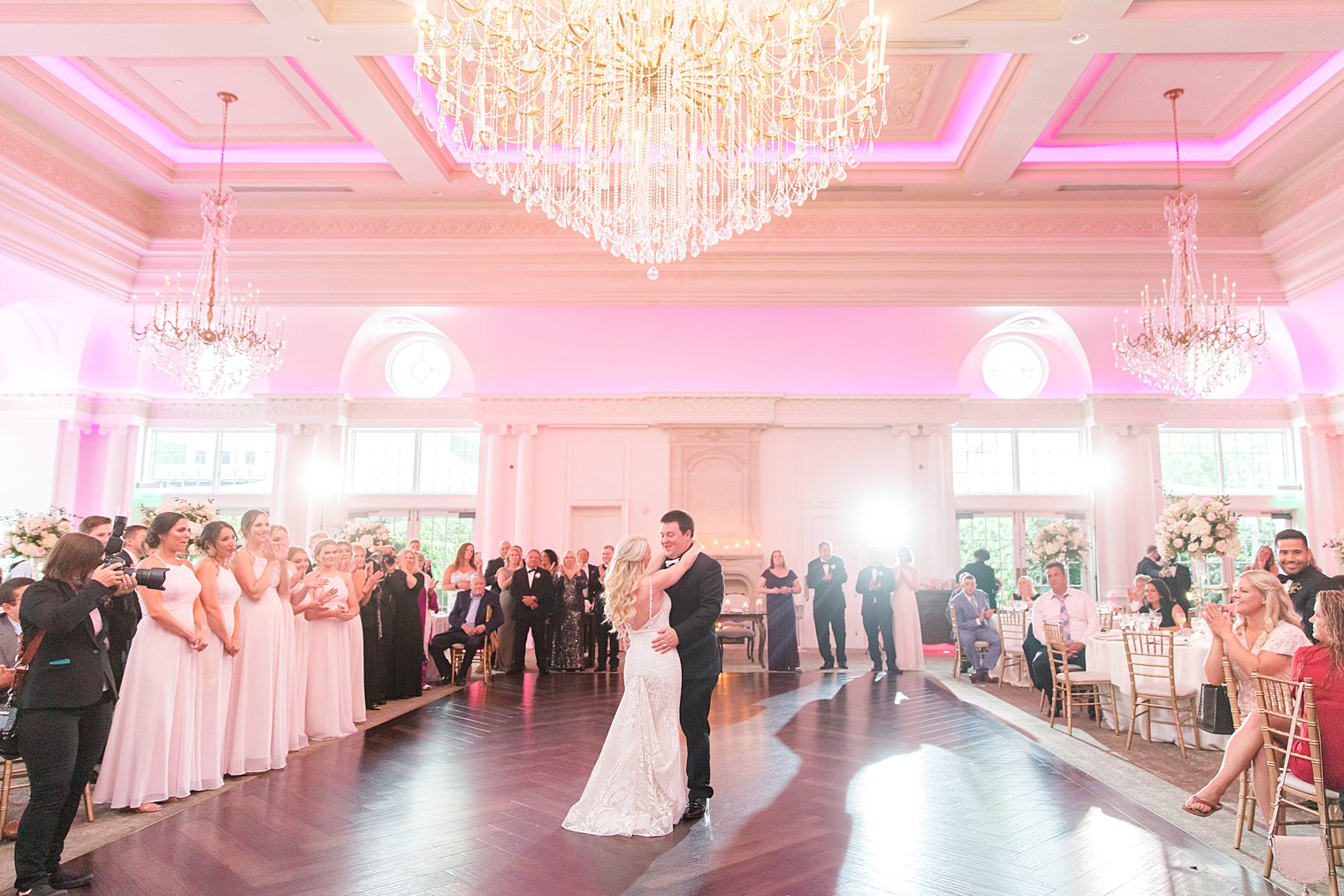 bride and groom dance together in Park Chateau Estate