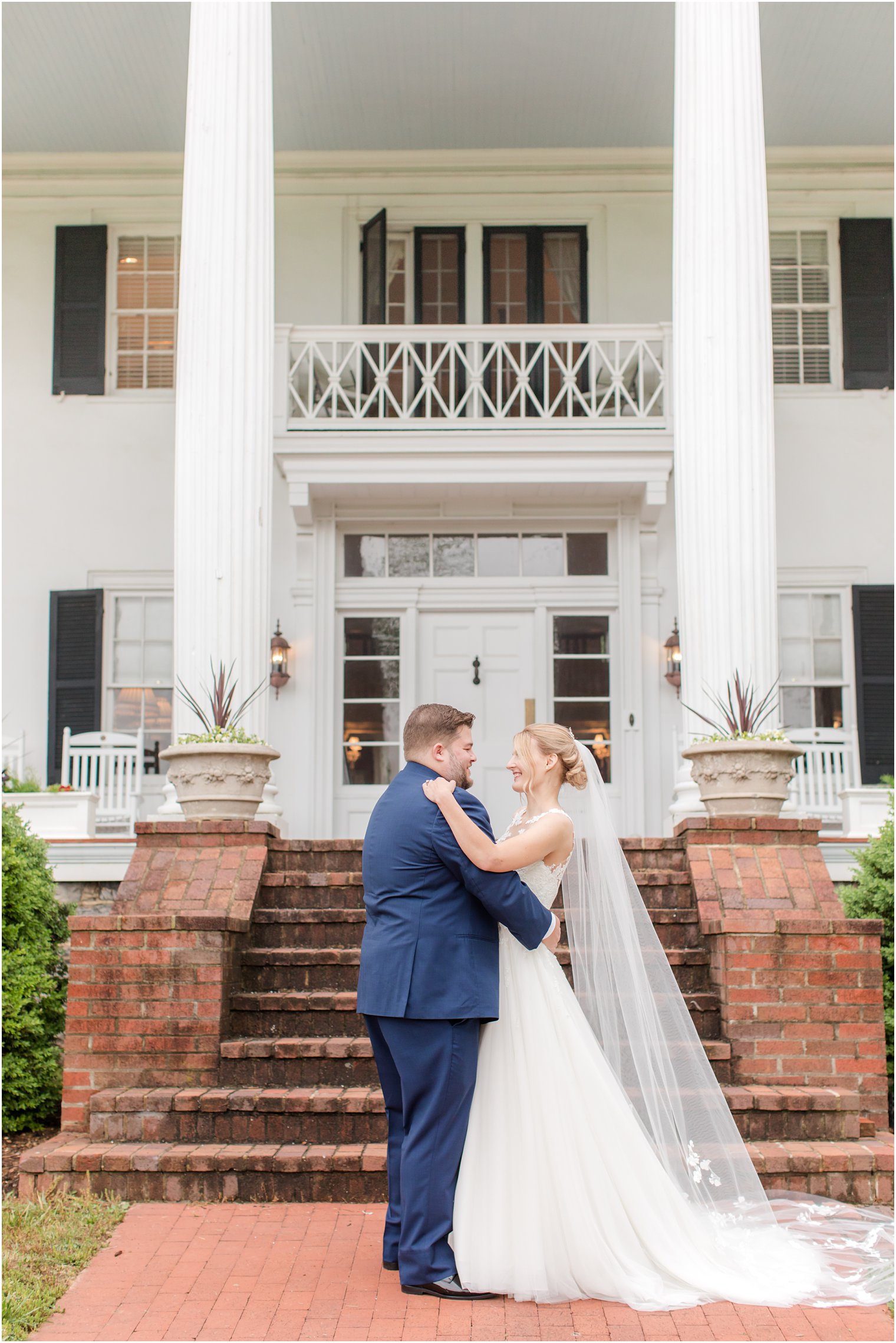 bride and groom hug before Berryville VA wedding on overcast day