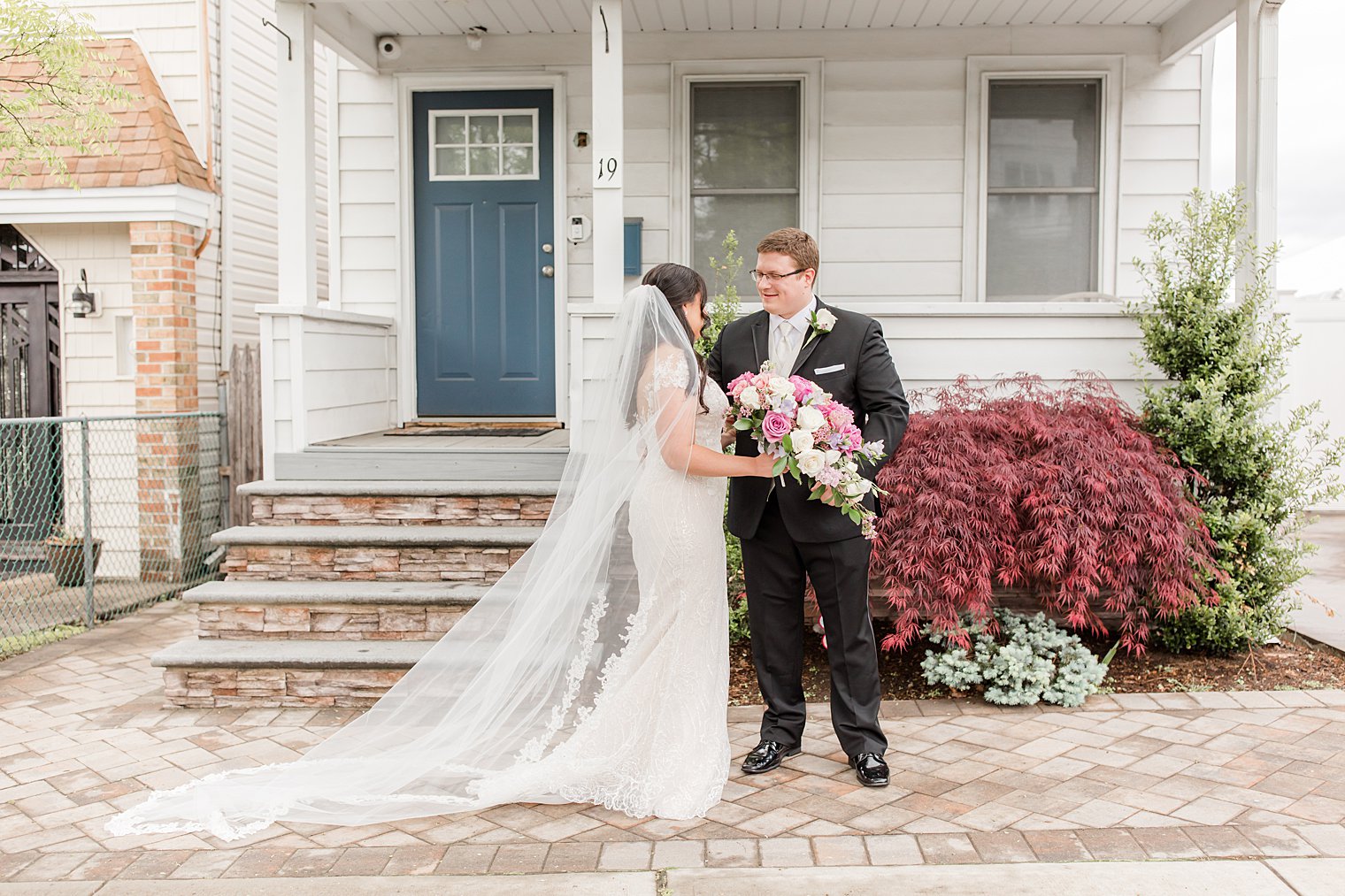 bride and groom have first look outside Staten Island home 