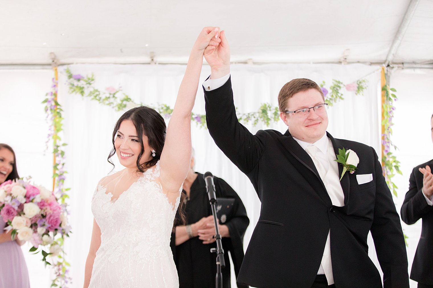 bride and groom cheer during Staten Island wedding