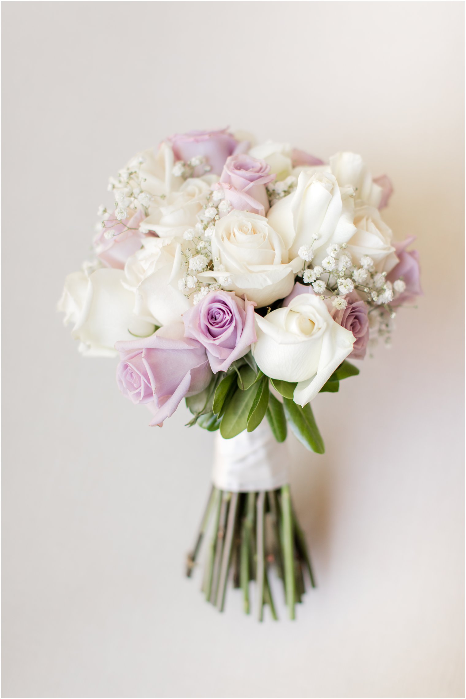 bride's bouquet of purple and ivory roses for The English Manor wedding