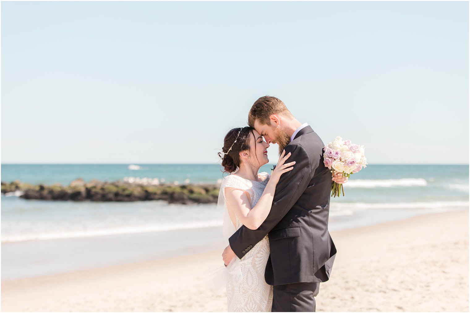 bride and groom stand nose to nose during Ocean Township NJ wedding photos