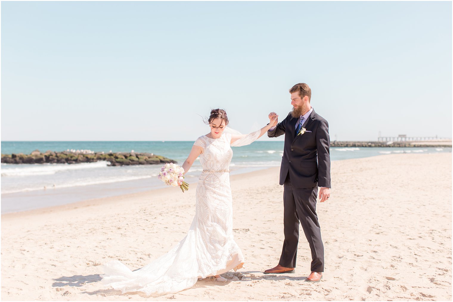 bride and groom dance on New Jersey beach