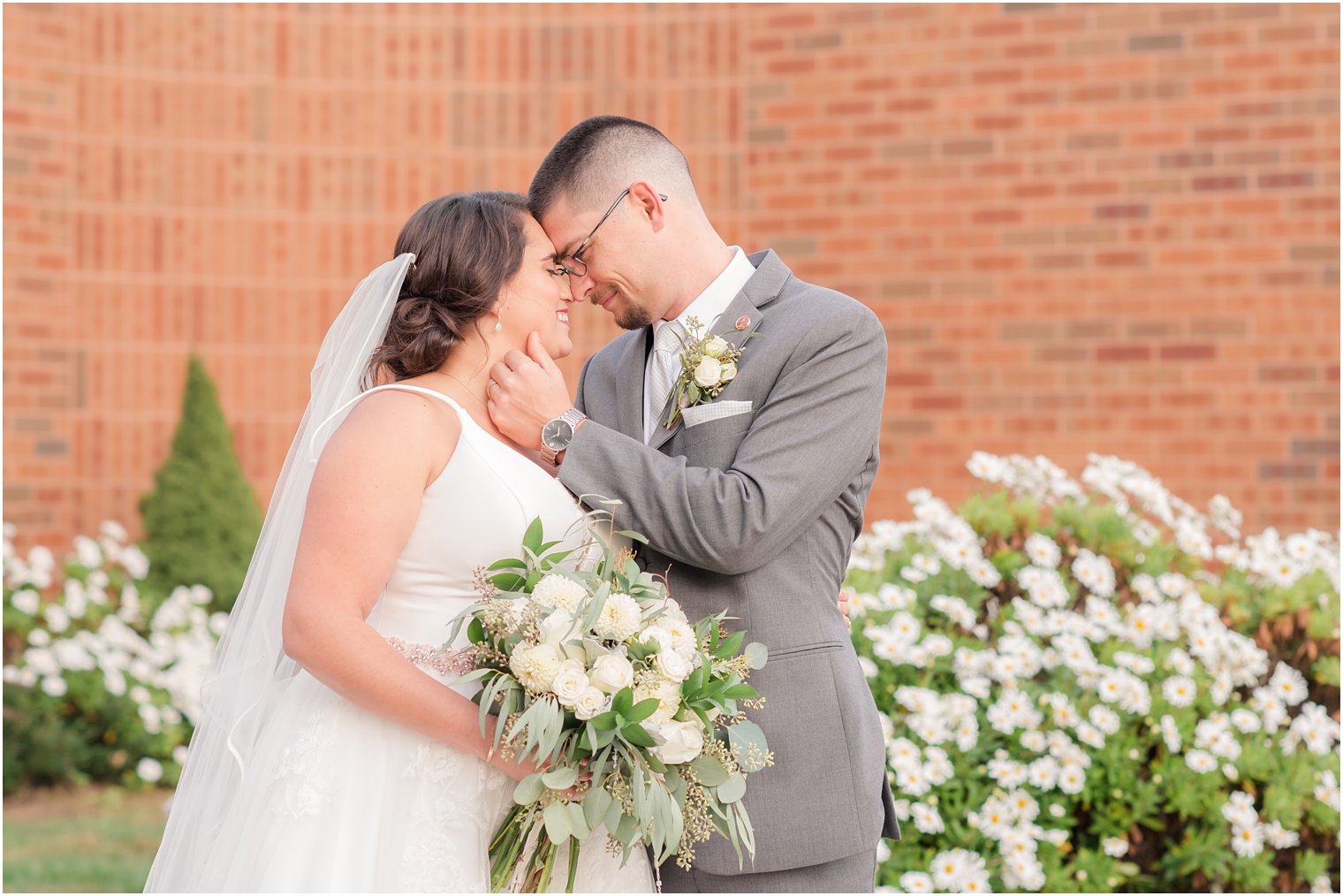 bride and groom pose forehead to forehead during NJ wedding photos