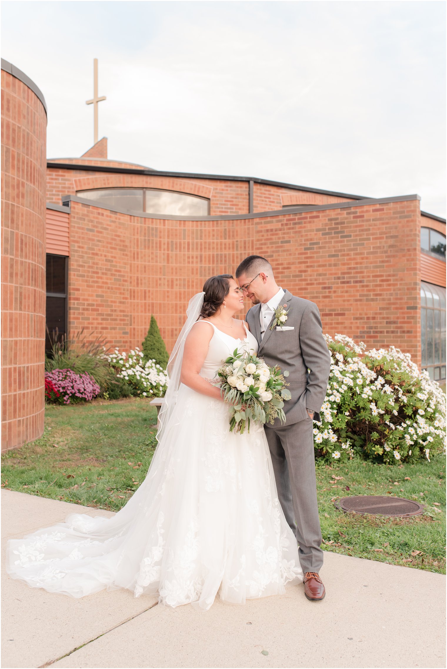 bride and groom stand nose to nose during NJ wedding photos