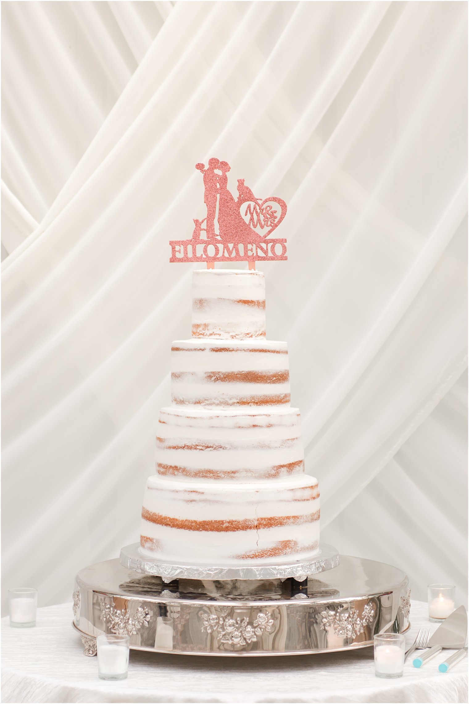 tiered naked wedding cake with pink topper