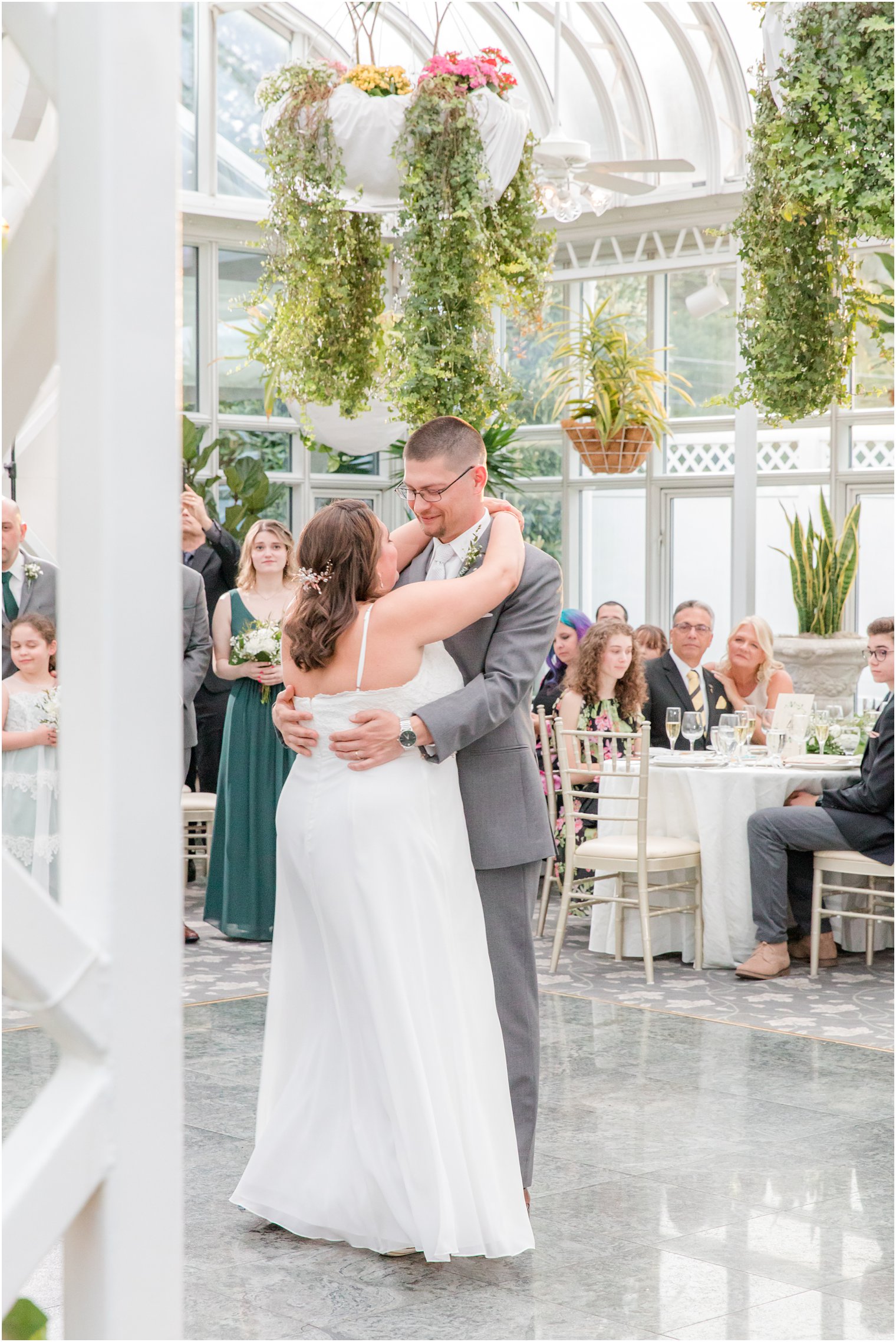 bride and groom have first dance during The Madison Hotel wedding reception