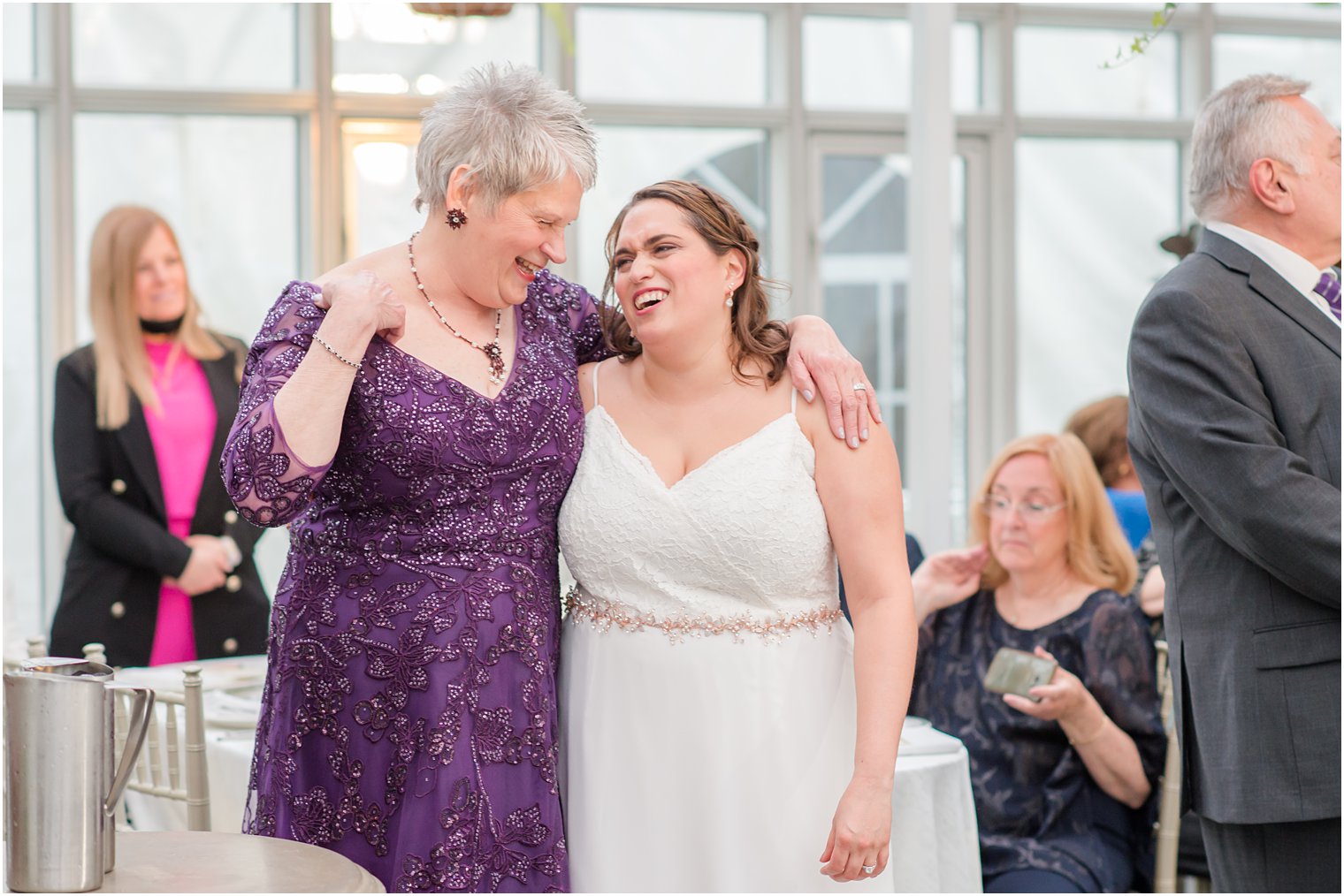 bride and mother hug during NJ wedding reception