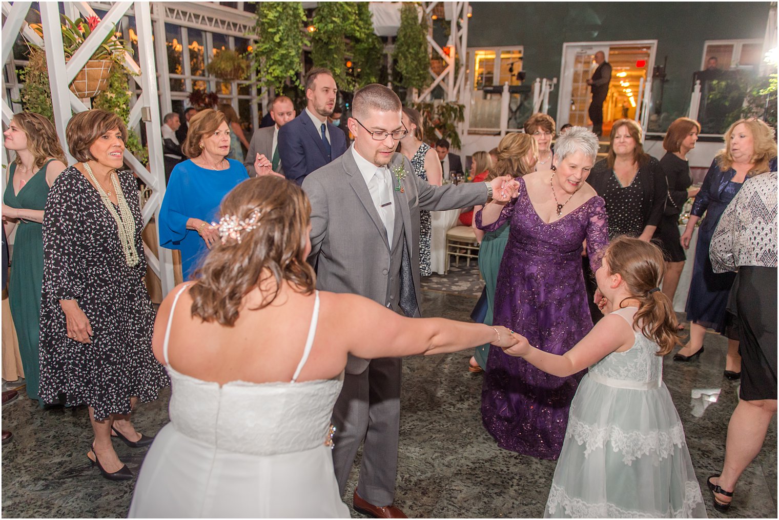 newlyweds dance with family members during NJ reception 