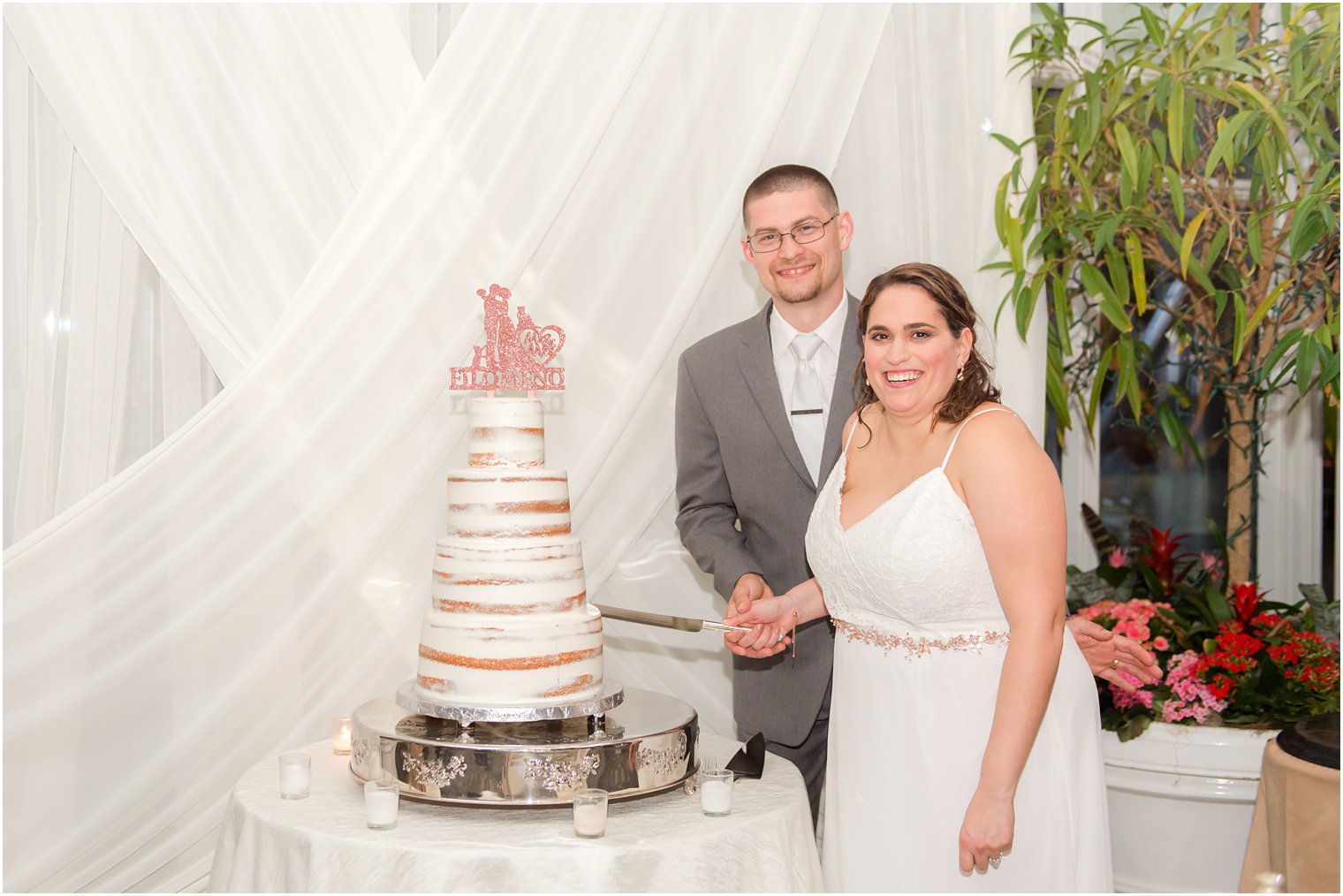 newlyweds cut wedding cake during NJ reception