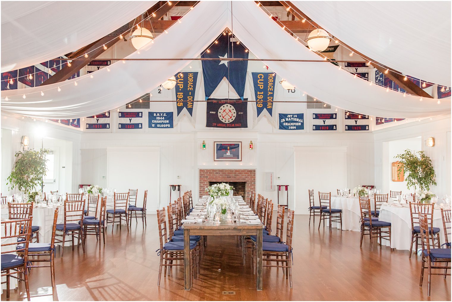 Bay Head Yacht Club wedding reception with family style table in central of room 
