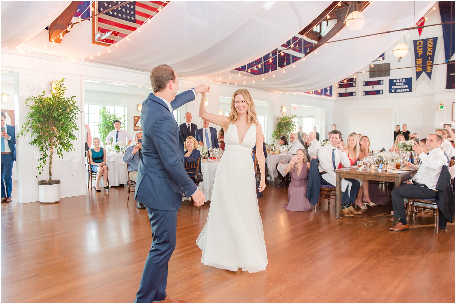 groom twirls bride during NJ wedding reception 