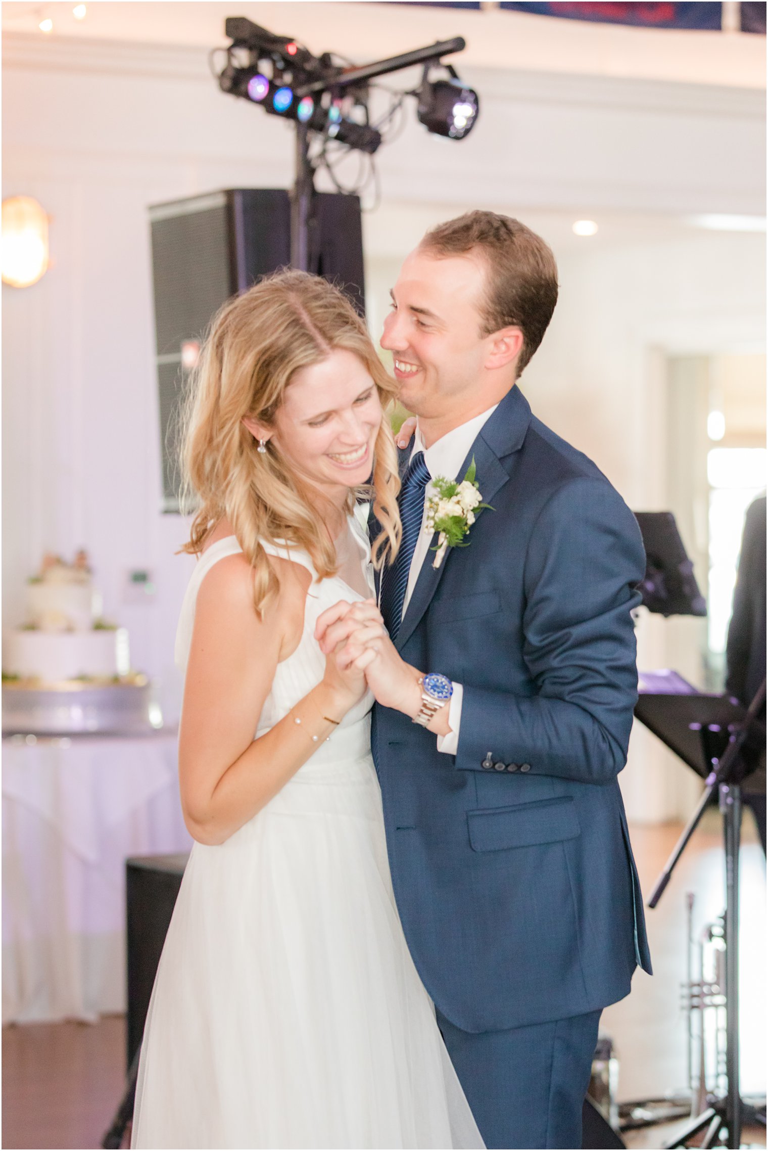 newlyweds dance together during Bay Head Yacht Club wedding reception 