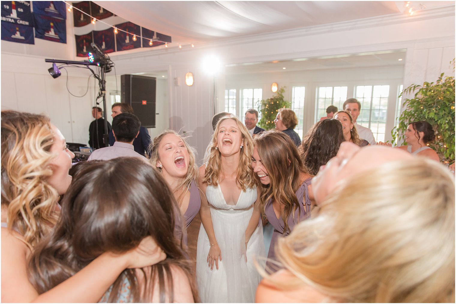 bride sings with bridesmaids during NJ wedding reception 