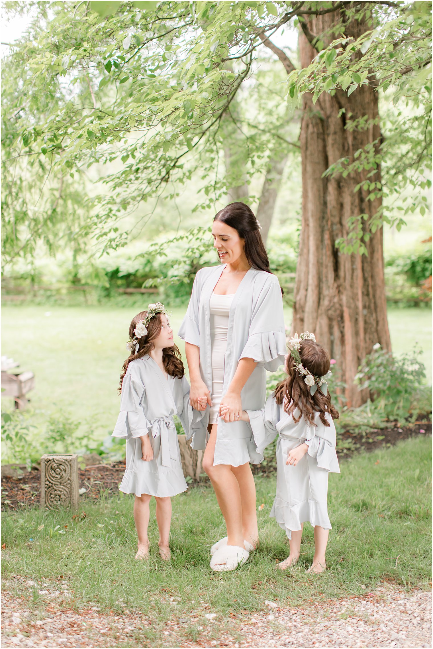 bride with two flower girls wearing flower crowns