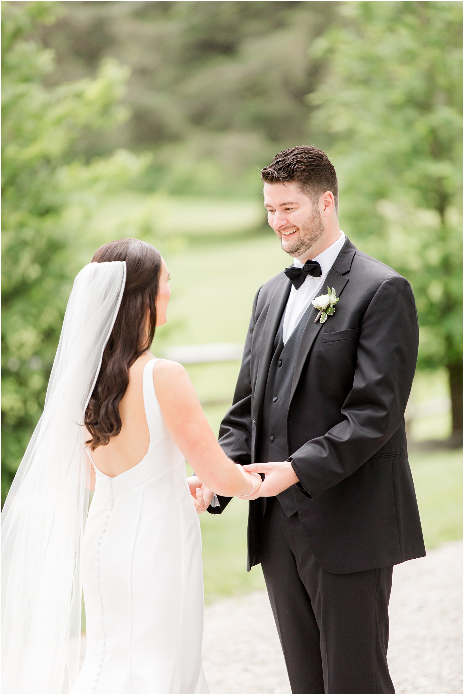 bride and groom smiling at each other after first look at Crossed Keys Estate