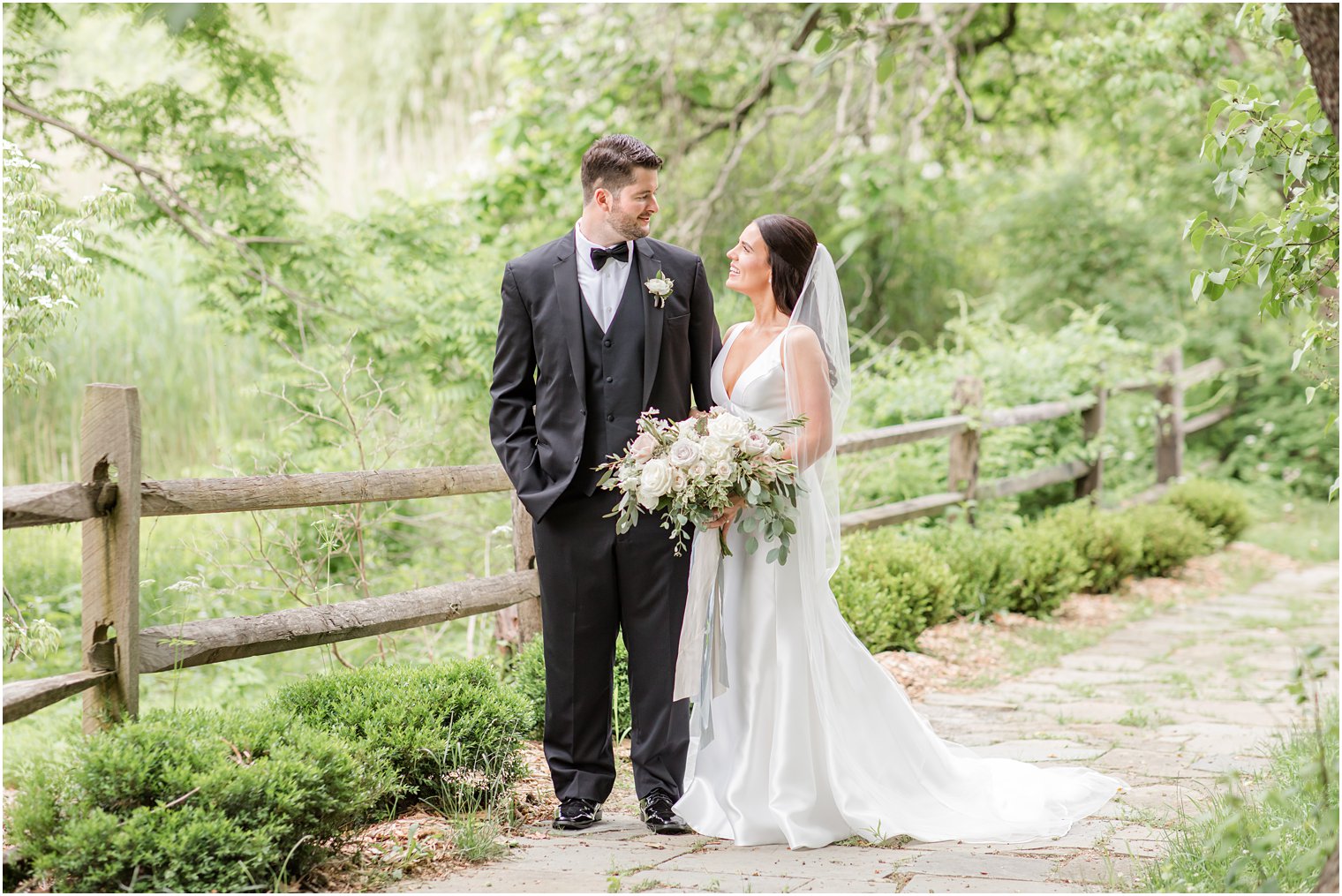 bride and groom posing for wedding portraits at Crossed Keys Estate