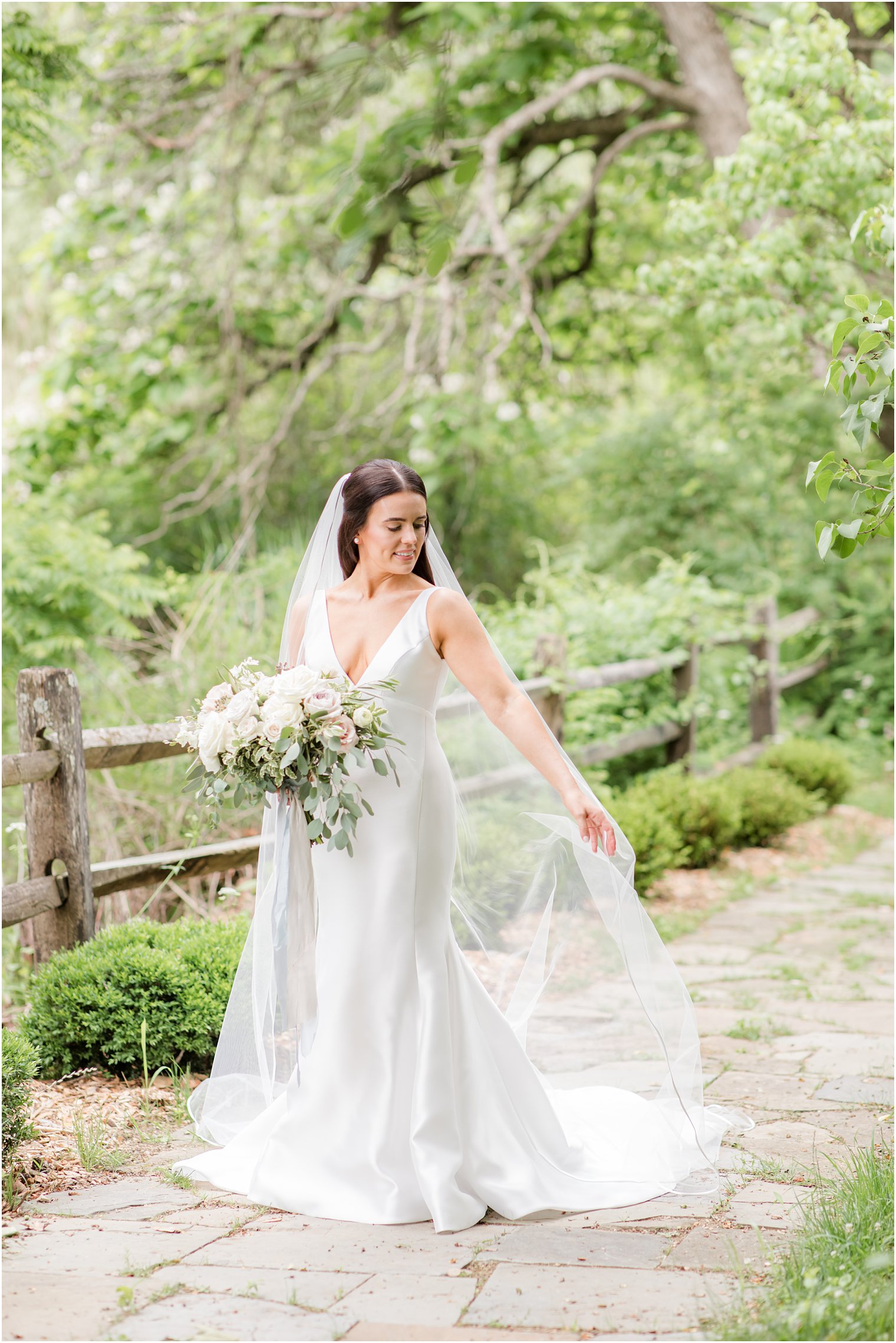 bride with cathedral veil at Crossed Keys Estate