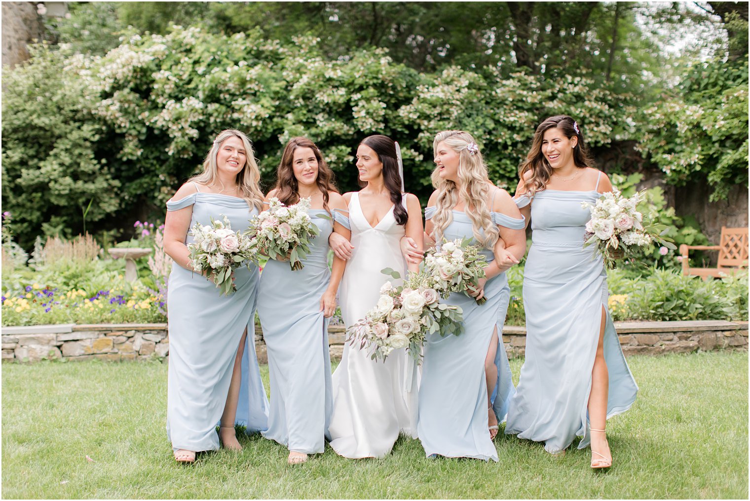bridesmaids wearing light blue dresses