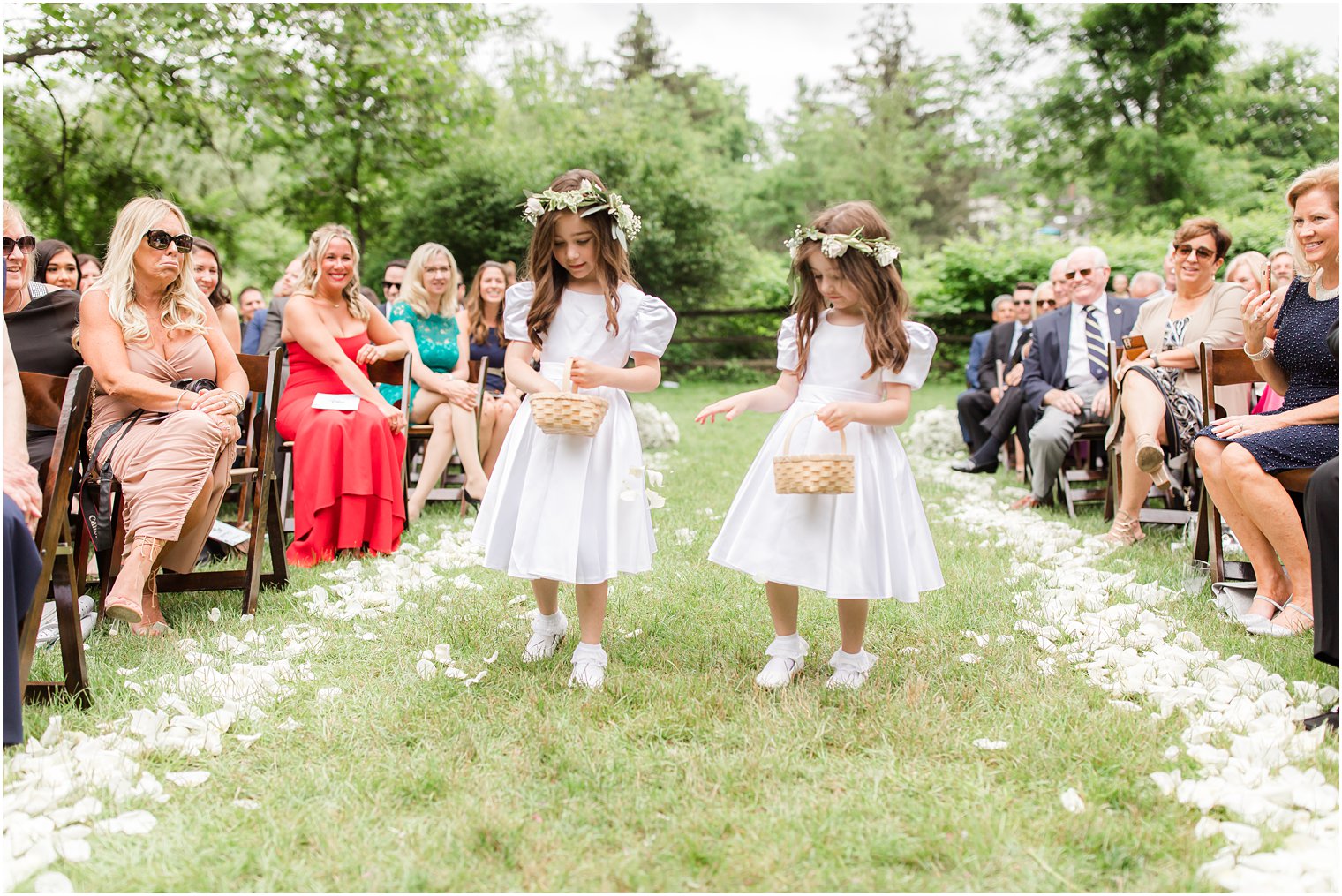 flower girls walking down the aisle