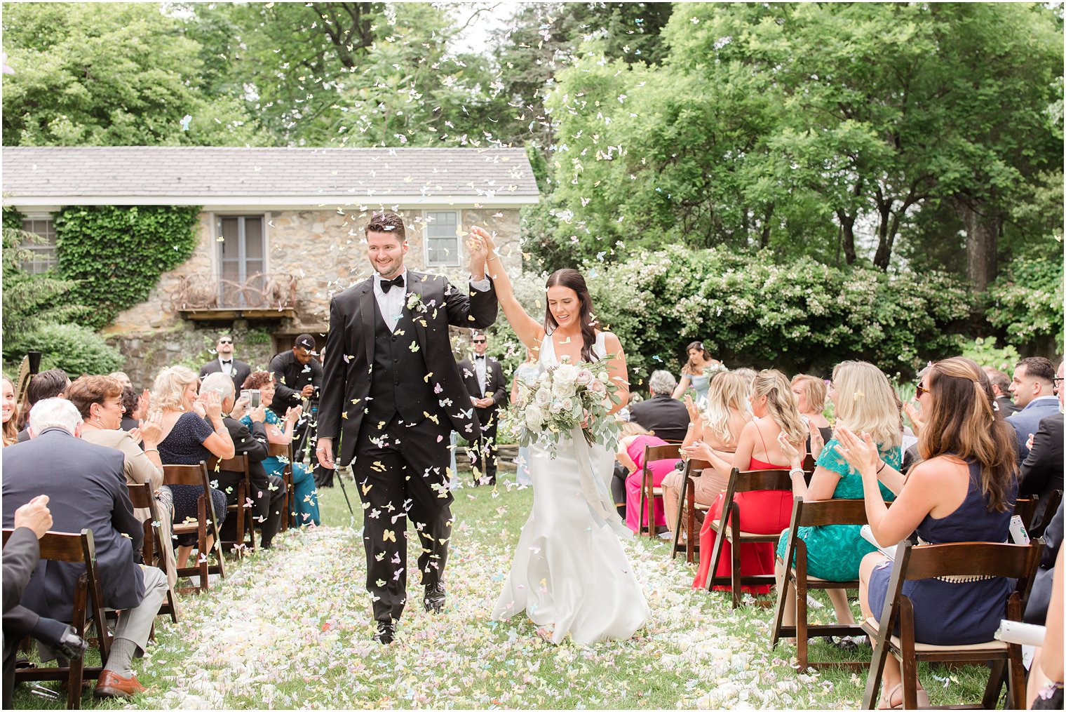 bride and groom recessional during ceremony with confetti cannons