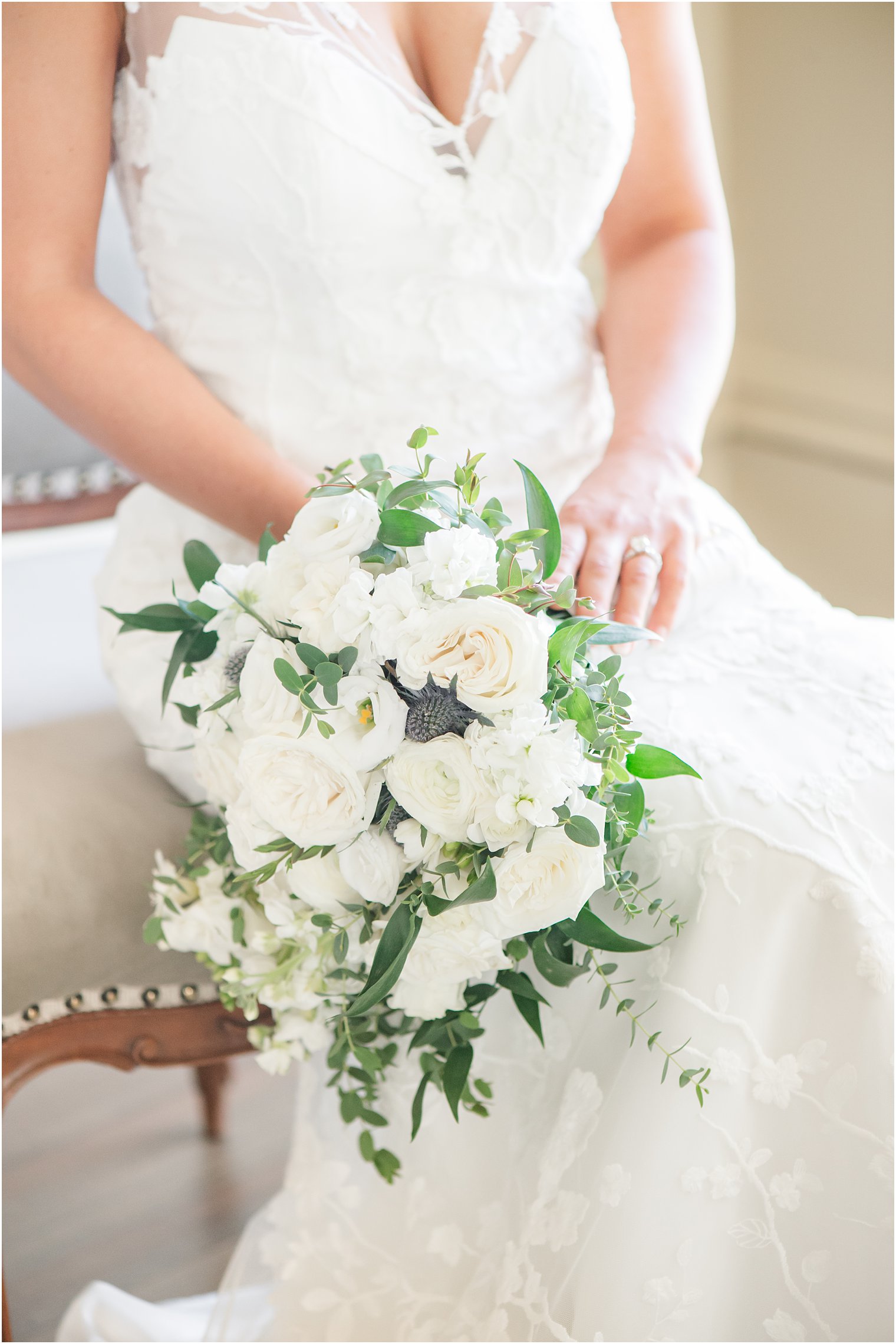 bride's summer bouquet with white flowers and greenery 