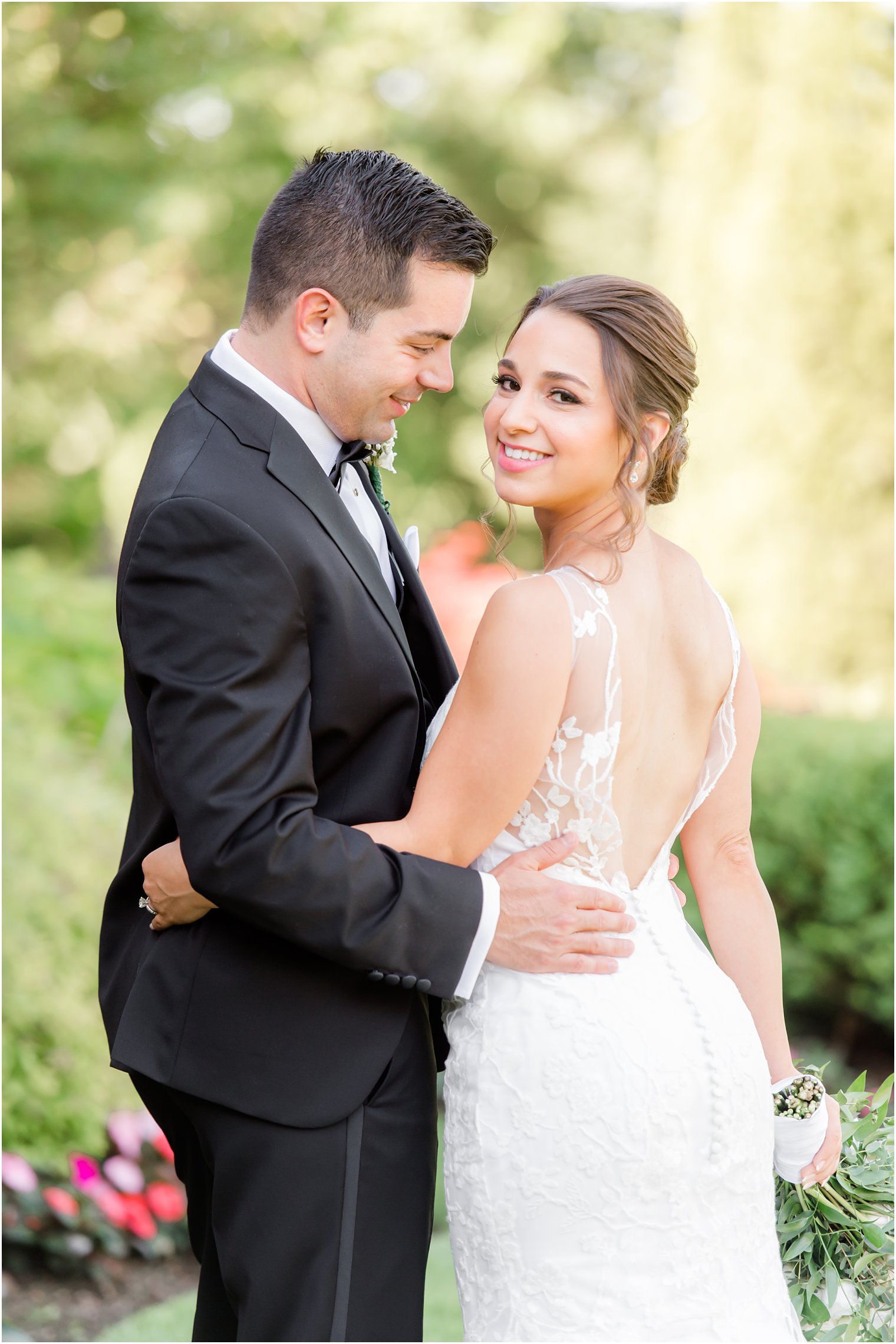 bride and groom hug in gardens at Park Savoy Estate