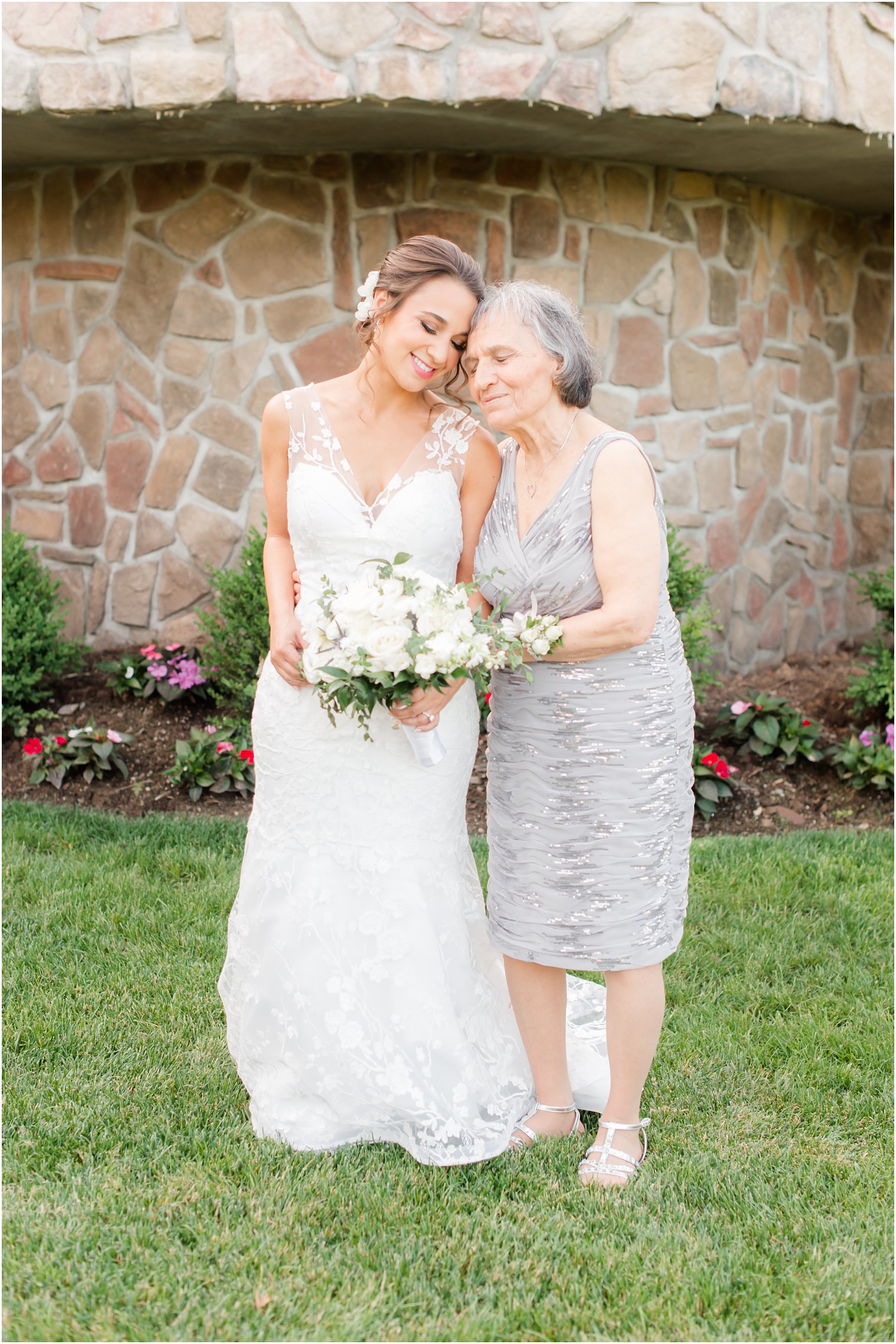 bride hugs grandma in grey dress before Park Savoy Estate wedding 