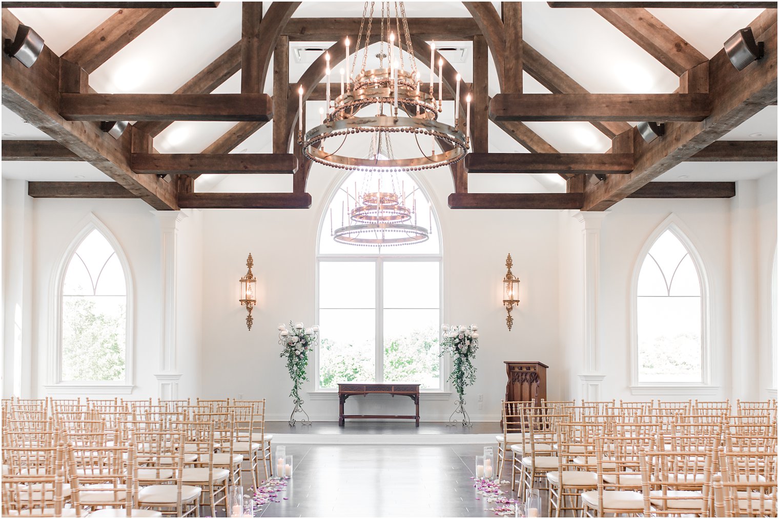spring wedding ceremony with petals down aisle at Park Savoy Estate