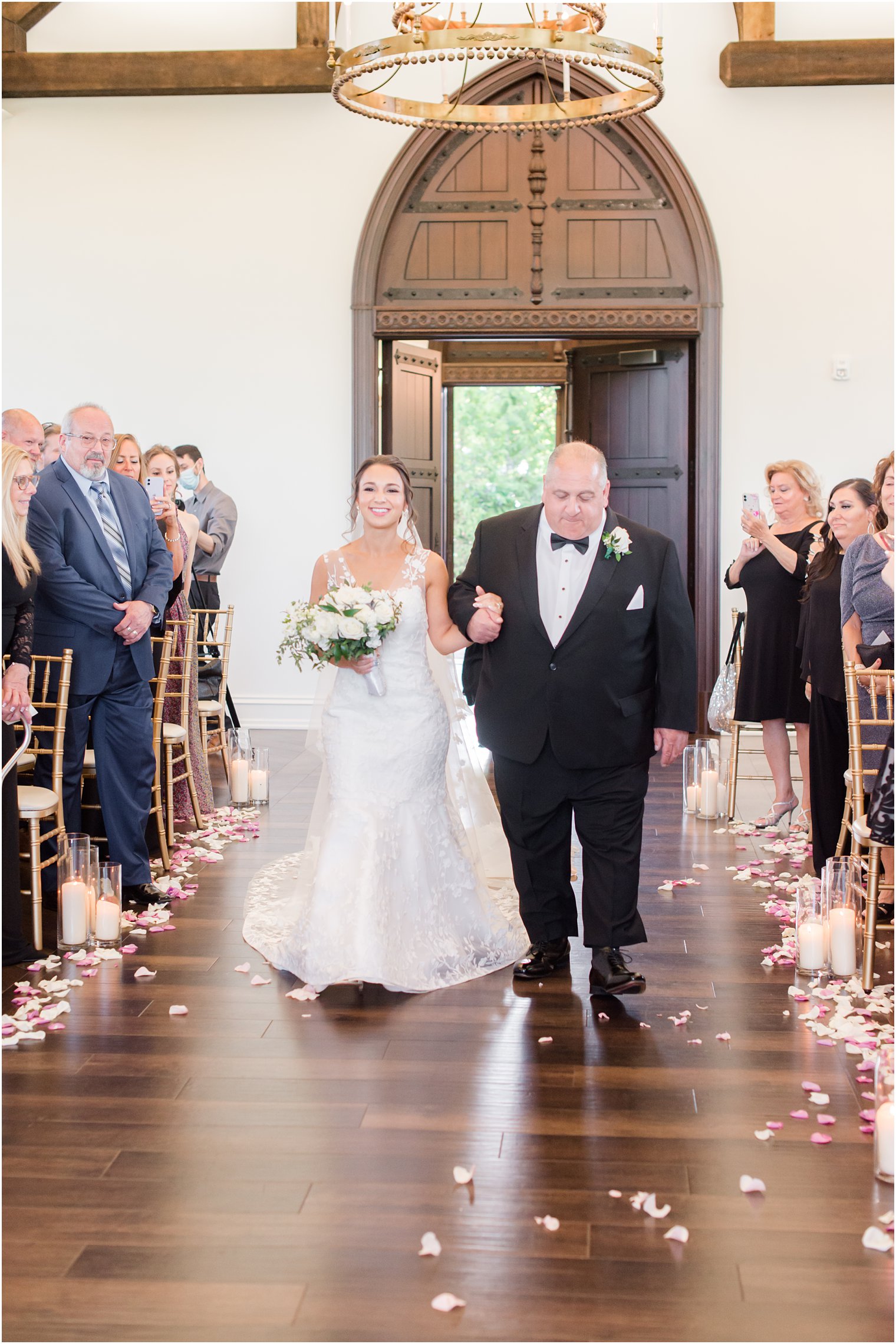 bride walks down the aisle with father during NJ wedding ceremony 