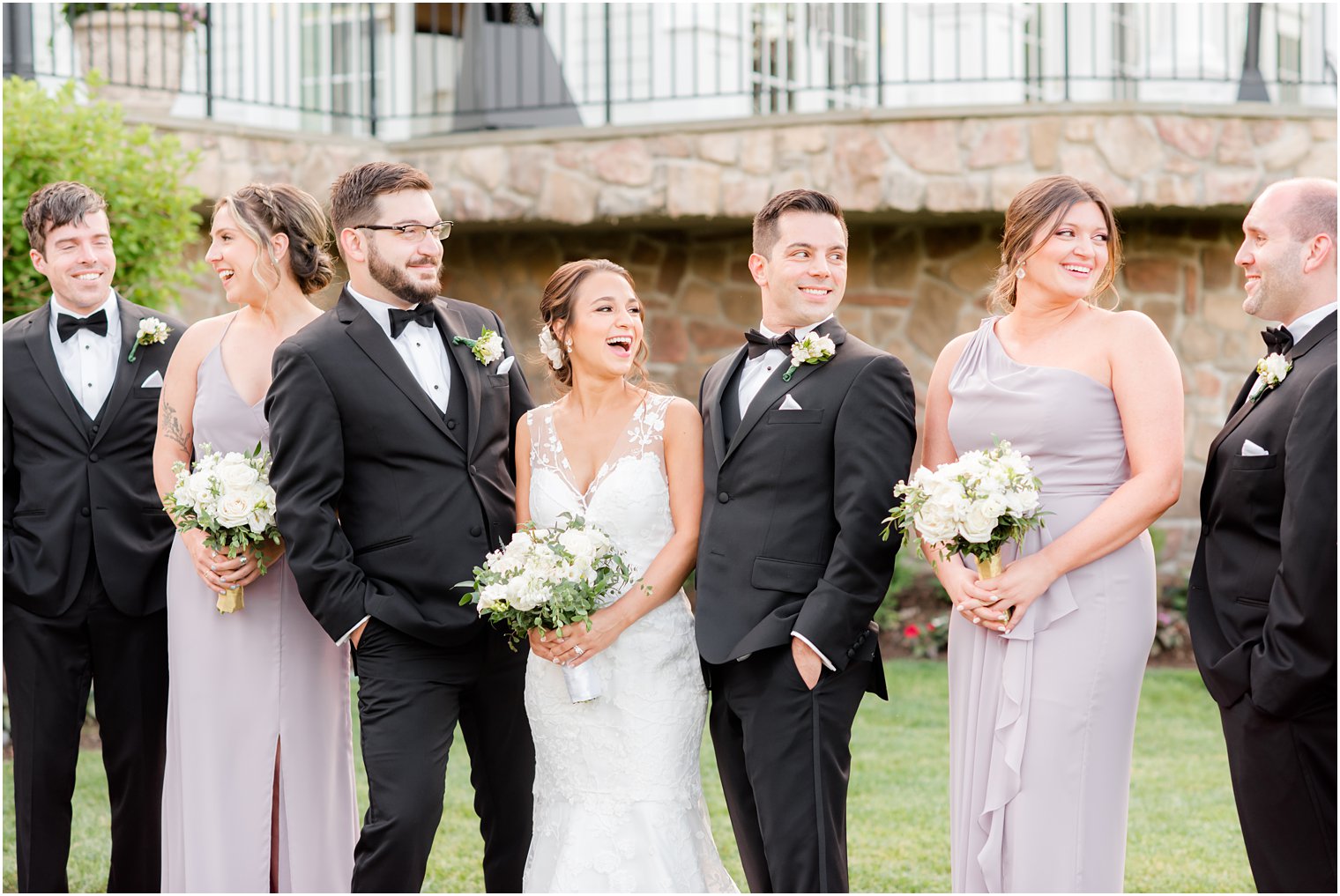 bride laughs with bridal party outside Park Savoy Estate