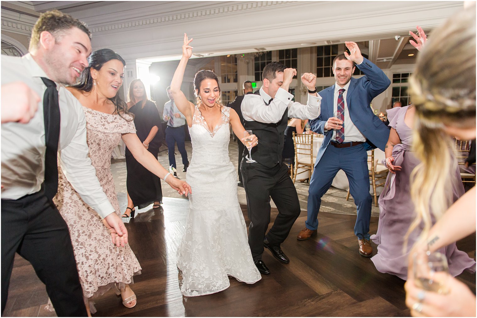 couple dances with guests during NJ wedding reception