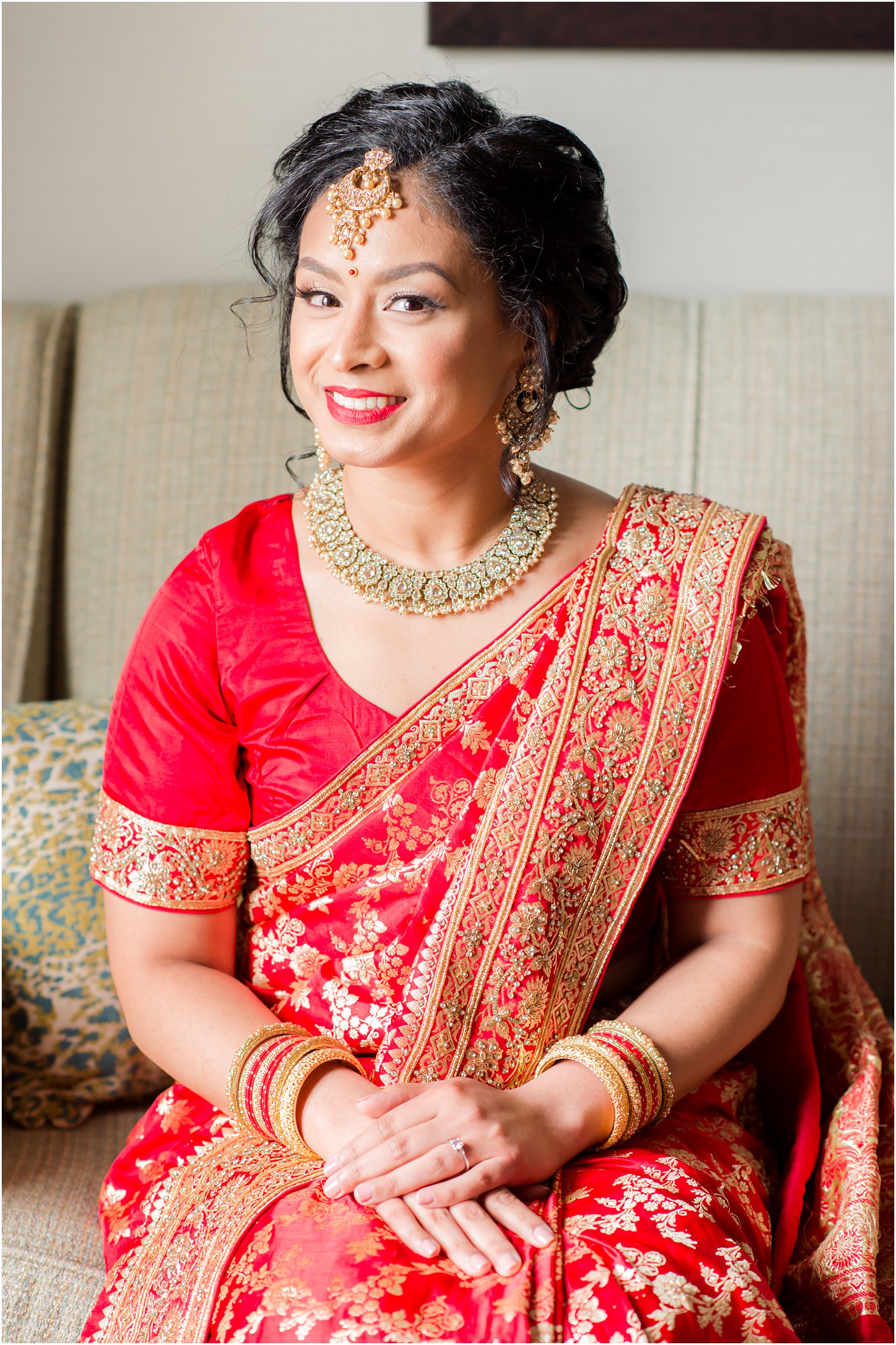 bride sits in sari before Indian wedding at the Ashford Estate