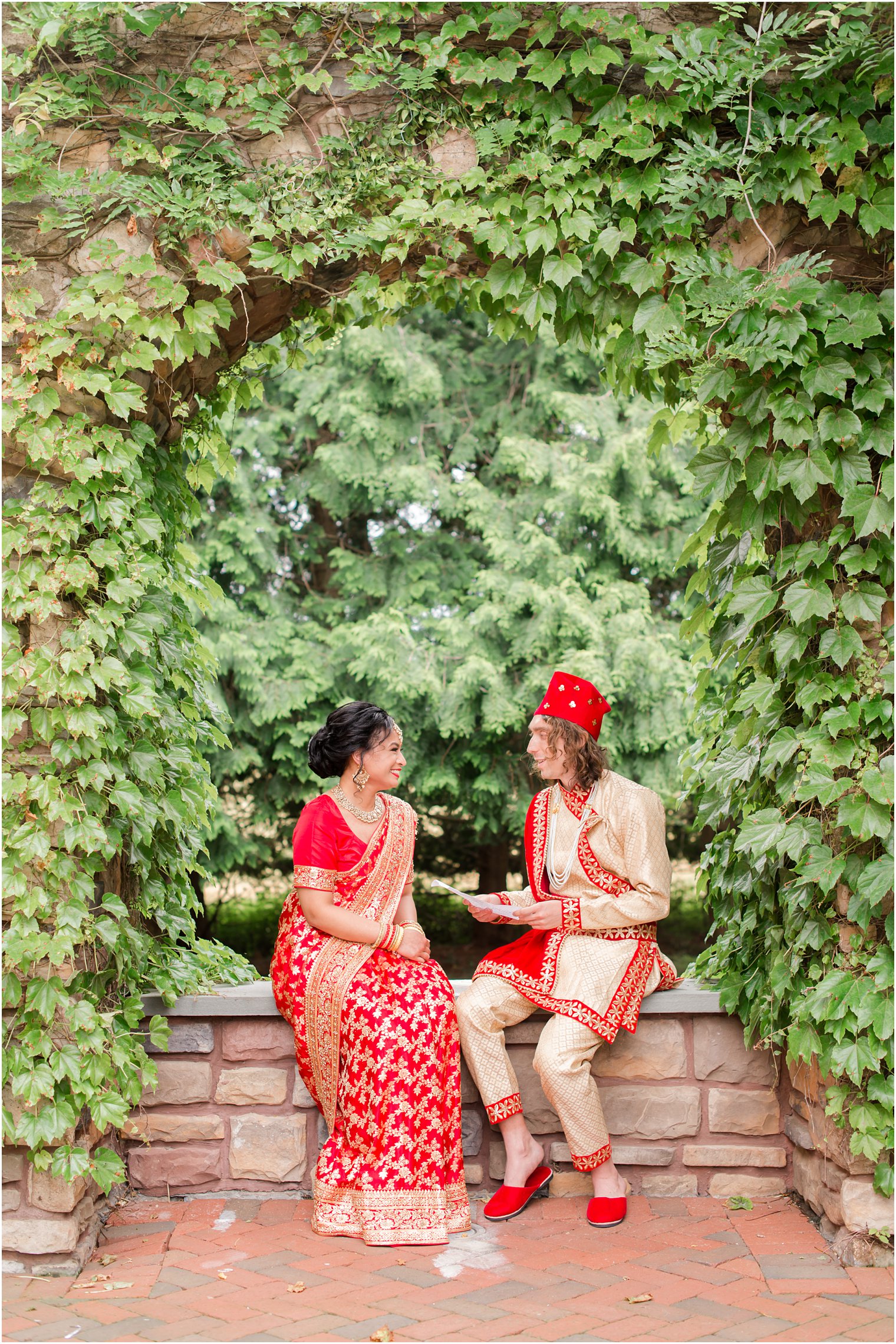 groom reads bride letter before Indian wedding at the Ashford Estate