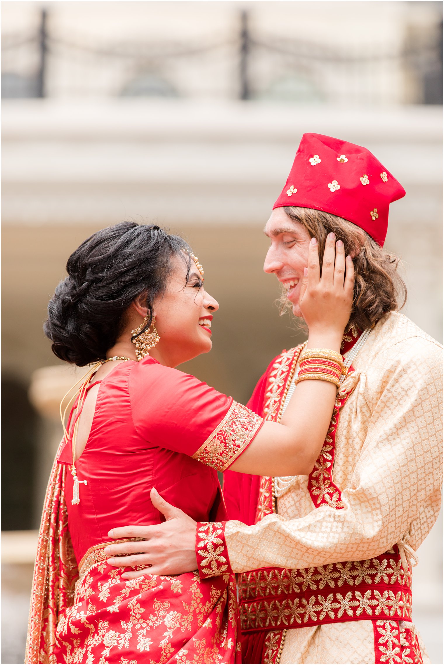 bride holds groom's cheek during portraits at the Ashford Estate 