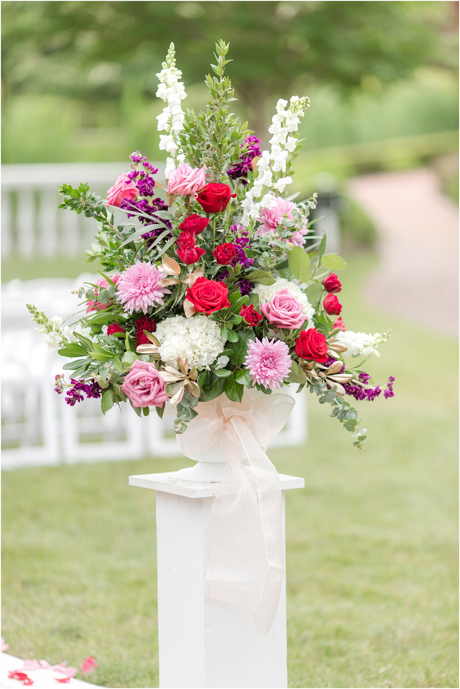 red, purple and pink floral display for ceremony at Ashford Estate 