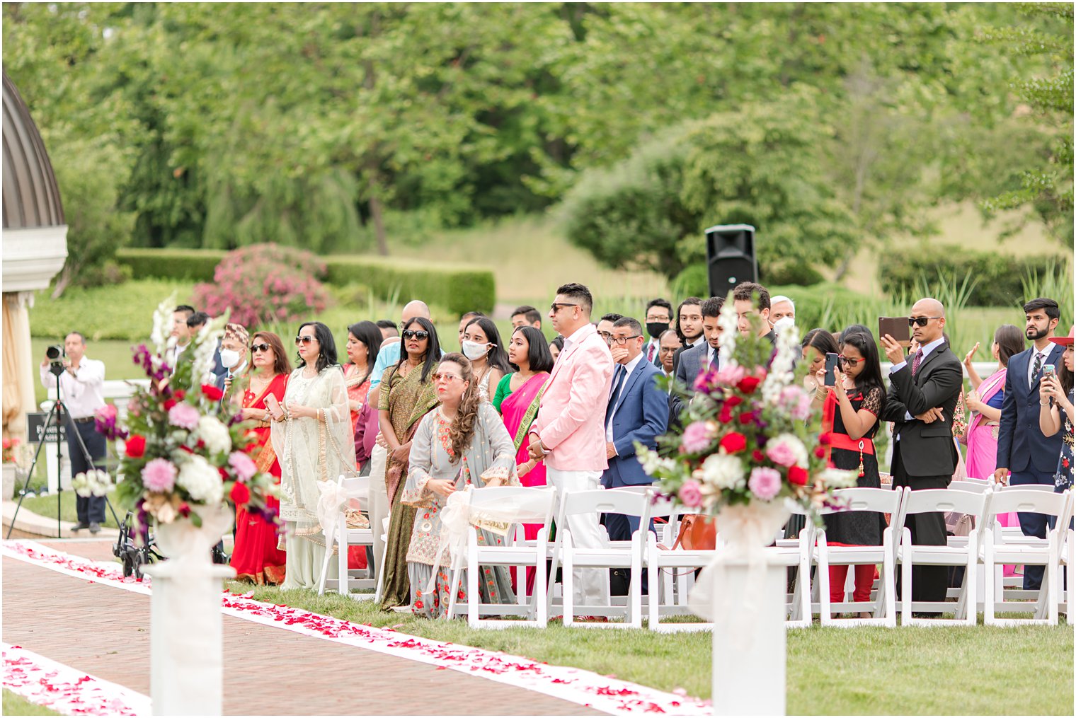 guests watch bride enter Indian wedding at the Ashford Estate