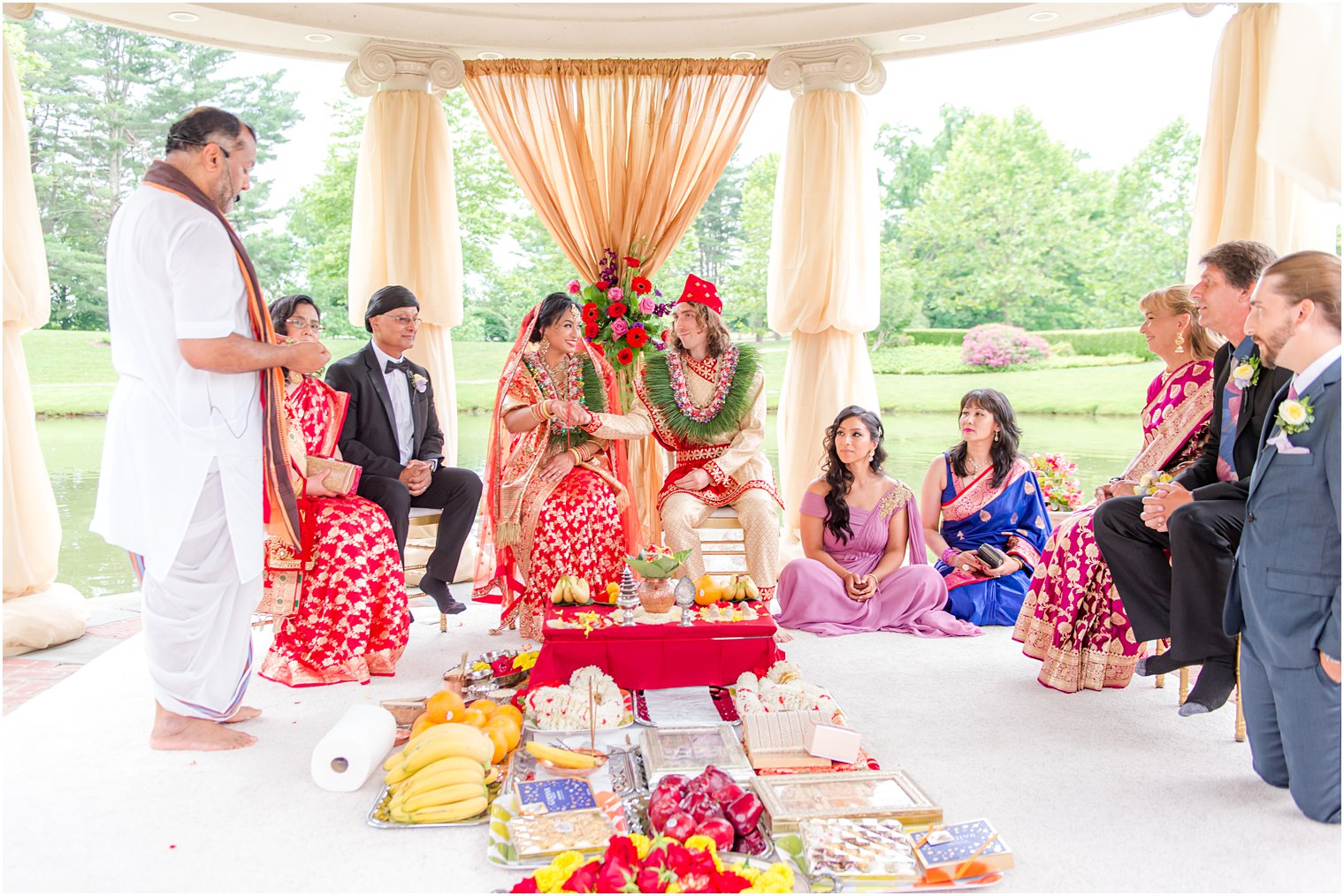 bride and groom sit during traditional Indian ceremony
