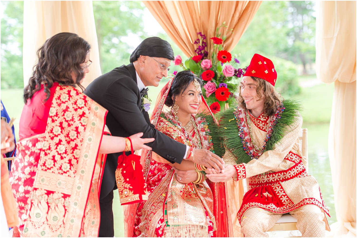 bride and groom sit together during traditional Indian wedding at the Ashford Estate
