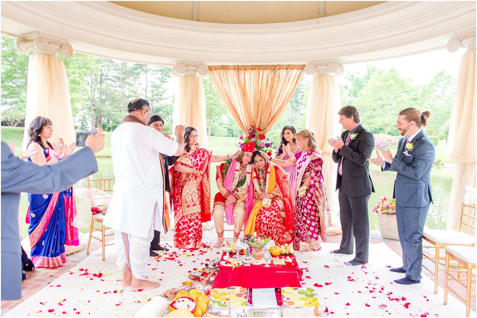 parents stand with bride and groom during traditional Indian wedding at the Ashford Estate