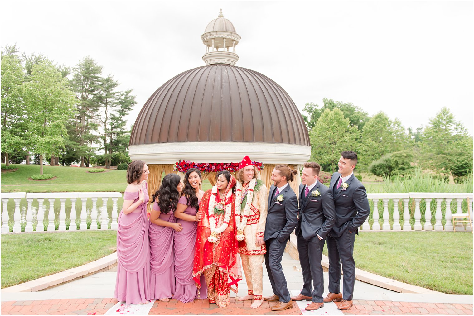 bride and groom pose with wedding party after traditional Indian wedding at the Ashford Estate