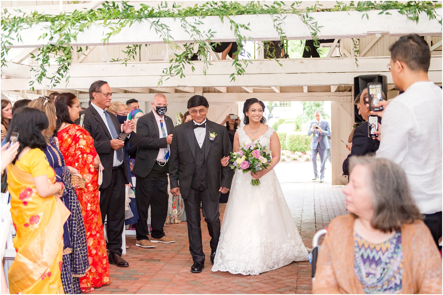 bride walks down aisle during Ashford Estate wedding ceremony 