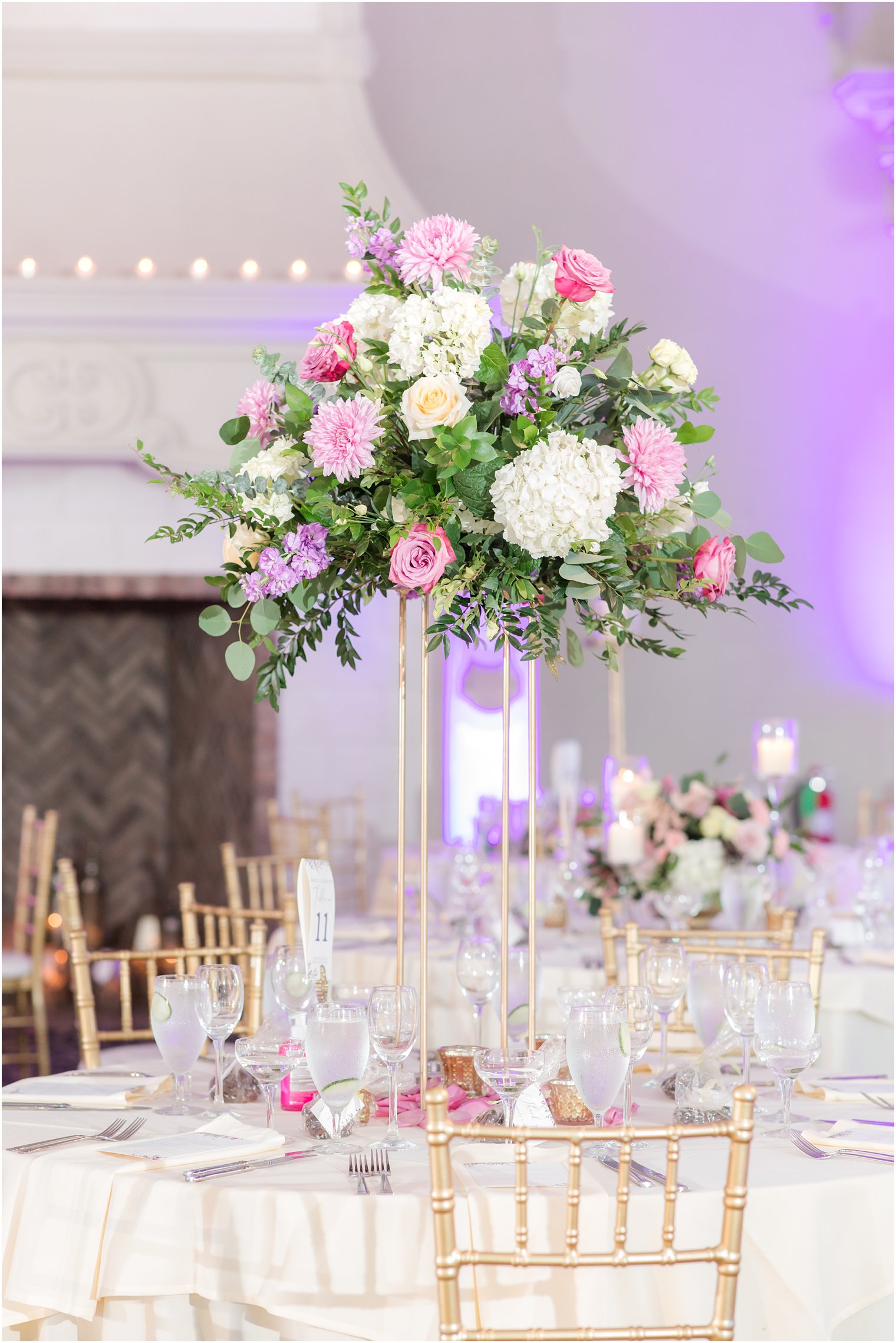 tall wedding centerpieces with pink and purple flowers 