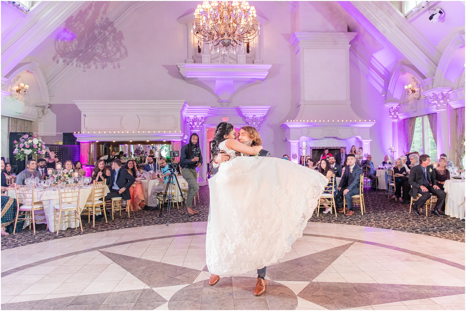 groom lifts bride during first dance at Ashford Estate