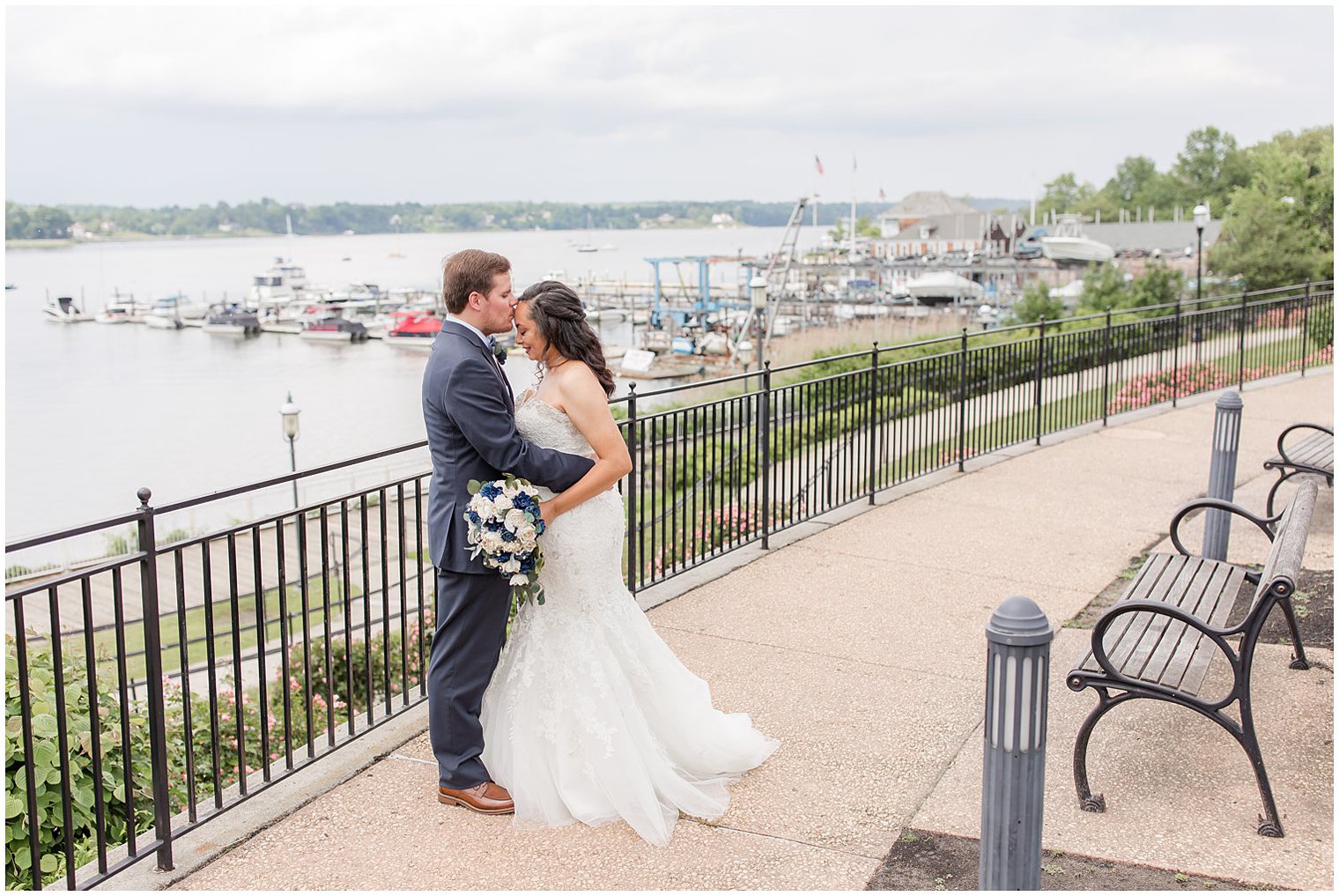 groom kisses bride's forehead during first look in Red Bank, NJ